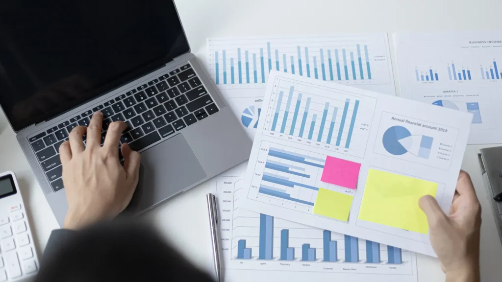 A person analyzing digital marketing reports, showcasing data-driven roles in digital marketing part time jobs.
